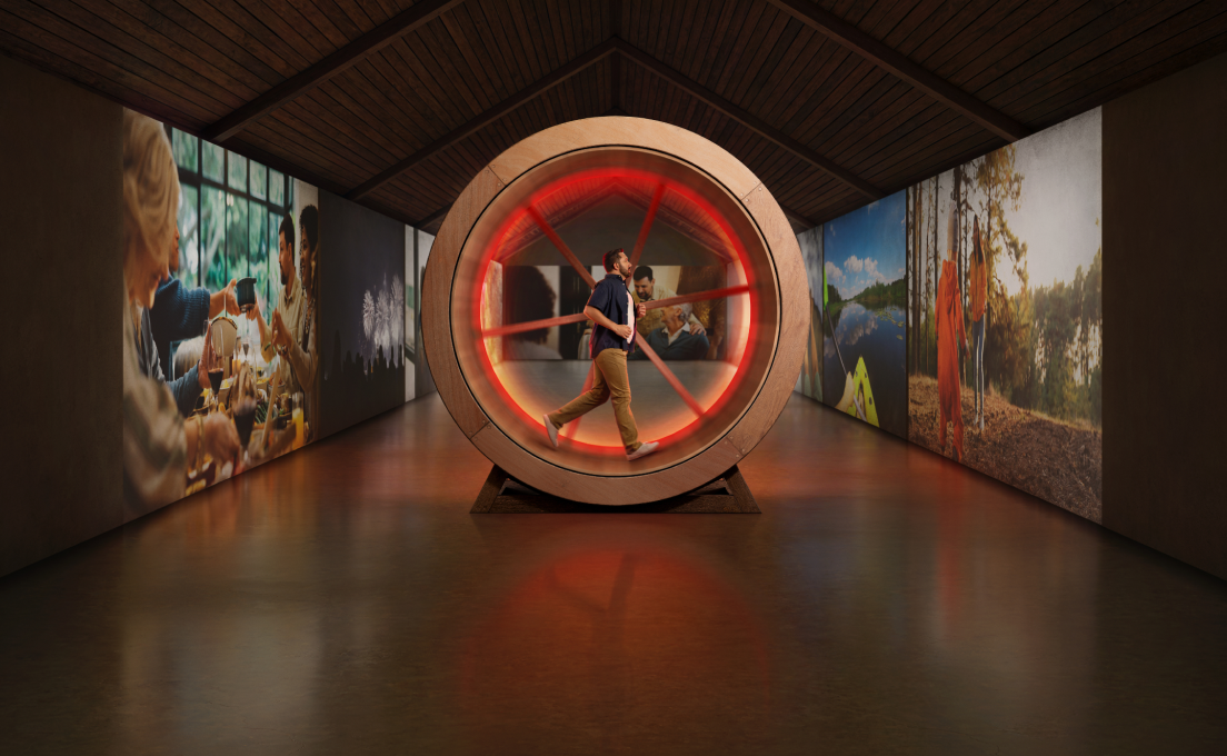 A person running continuously on a wooden wheel.