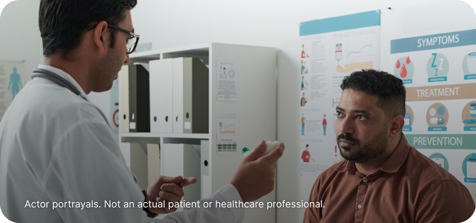 Actor portrayal of a doctor and patient discussing triglyceride levels in a doctor's office.
